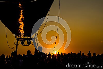 Image of the evening sun with the flaming silhouette with balloon is being. Stock Photo
