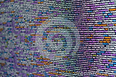 The image features a close-up of colorful data cables in a complex, structured network against a light gray backdrop Stock Photo