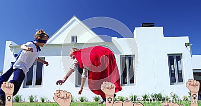 Image of female fists over flower and mom playing with son Stock Photo
