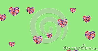 Image of flower filled heart shapes floating over light green background Stock Photo