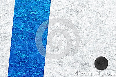 Image of a fragment of a hockey arena with a blue line and a puck Stock Photo