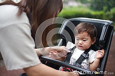 A girl who hates child seats for bicycles Stock Photo