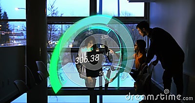 Image of green speedometer over diverse businesspeople using laptops Stock Photo