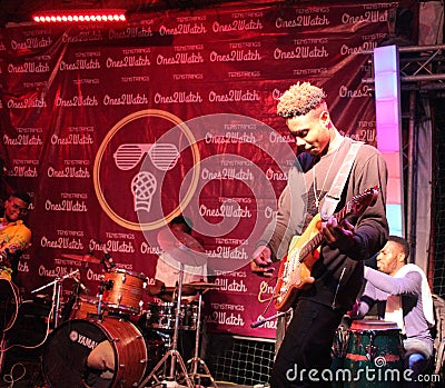 Image of a guitarist in concert. Editorial Stock Photo