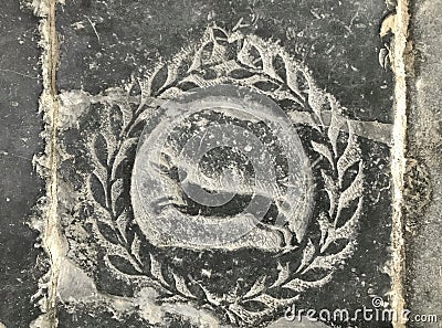 Image of a heir with a laurel wreath on a tomb Stock Photo