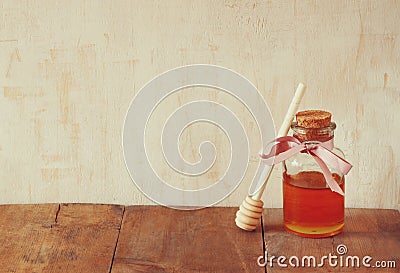 Image of honey glass jar. rosh hashanah (jewish holiday) concept. traditional holiday symbols. Stock Photo