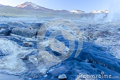 Image of hot steams and smoke columns. Taken during the sunrise at Geysers of Tatio at Los Flamencos national reserve in Atacama Stock Photo