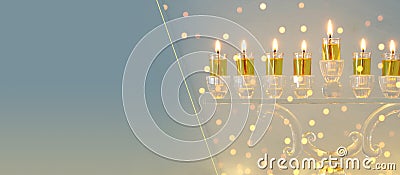 image of jewish holiday Hanukkah background with crystal menorah & x28;traditional candelabra& x29; and candles. Stock Photo