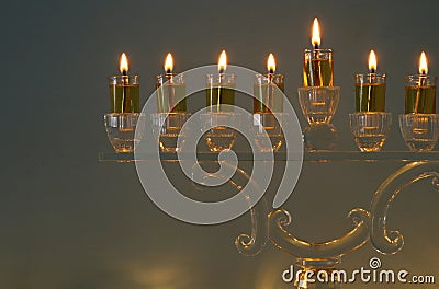 image of jewish holiday Hanukkah background with traditional spinnig top, doughnuts and menorah Stock Photo