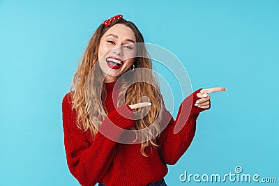 Image of joyful caucasian woman laughing and pointing fingers aside Stock Photo