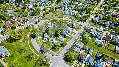 Large aerial neighborhood in summertime with large green trees in city two-story houses Stock Photo