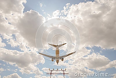 Large passenger plane flying overhead Stock Photo