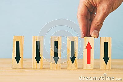 image of man hand pick one from many wooden blocks. business concept Stock Photo