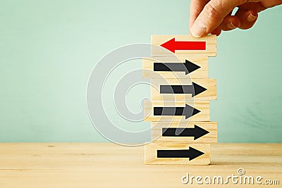 image of man hand pick one from many wooden blocks. business concept Stock Photo