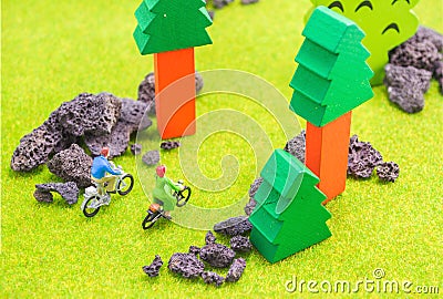 image of man and woman(mini figure dolls) with retro bicycle in Stock Photo