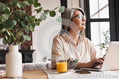 Thinking concentrated business woman Stock Photo