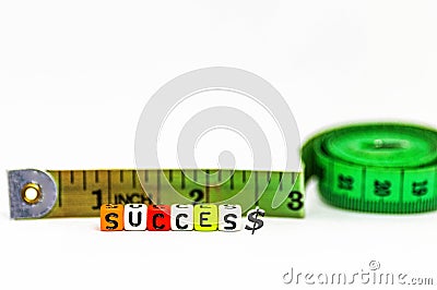 Image of measuring success concept in life and business. Colorful alphabet beads spelling Stock Photo