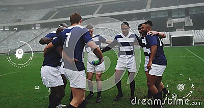 Image of media icons over diverse male rugby team in huddle at stadium Stock Photo