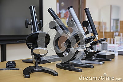 Microscopes on a school desk Stock Photo