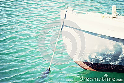 Image of a moored dinghy in lightly waving water Stock Photo