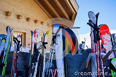 Image of multi-colored skis and snowboards in snow at winter resort in afternoon. Editorial Stock Photo