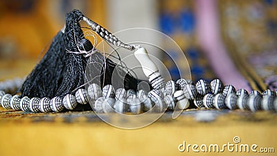 Image of Muslim prayer bead on prayer mat Stock Photo