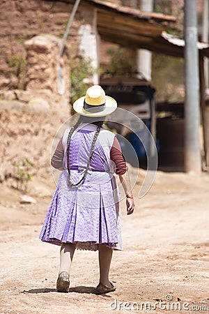 Image of a old woman walking in a Andean town in Urubamba Peru Editorial Stock Photo