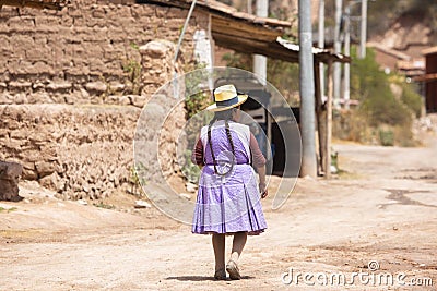 Image of a old woman walking in a Andean town in Urubamba Peru Editorial Stock Photo