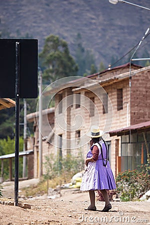 Image of a old woman walking in a Andean town in Urubamba Peru Editorial Stock Photo