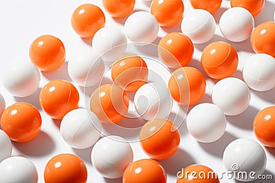 Image of Orange ping pong balls surrounded with white balls generative AI Stock Photo