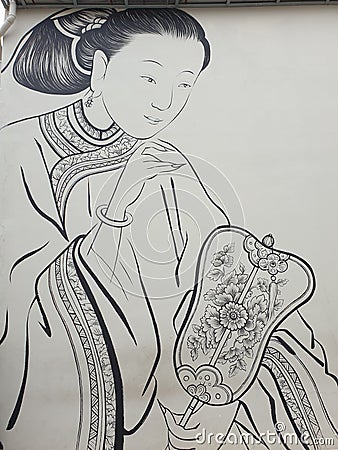 Oriental lady holding a fan Editorial Stock Photo