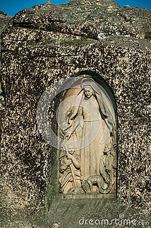 Image of Our Lady of the Good Star carved in a rocky cliff Stock Photo