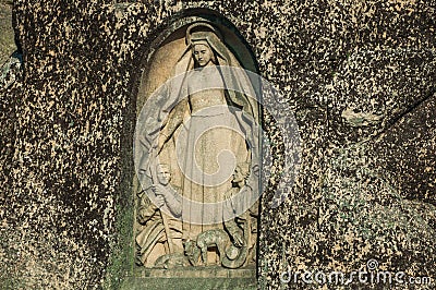 Image of Our Lady of the Good Star carved in a rocky cliff Stock Photo