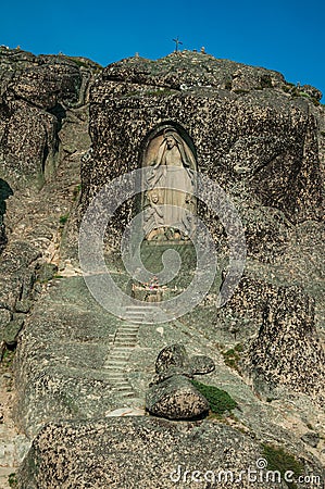 Image of Our Lady of the Good Star carved in a rocky cliff Stock Photo