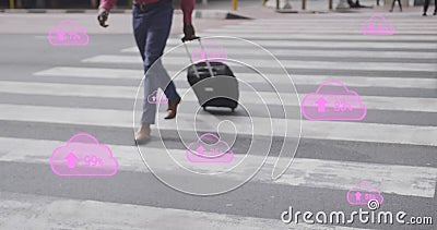 Image of pink digital clouds with numbers growing over man crossing street with suitcase in city Stock Photo