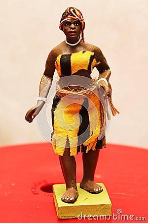 Colorful Traditions of Ghana: Clay Figurine Depicts a Young Lady Getting Ready to Dance. Editorial Stock Photo