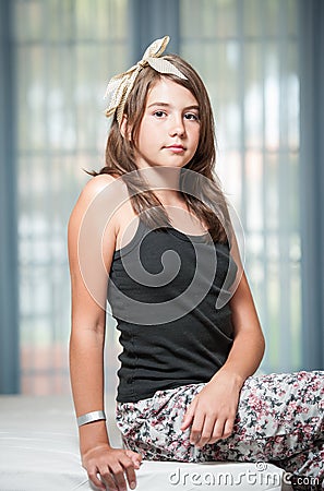 .Image of pretty teenager posing indoor in a good mood Stock Photo