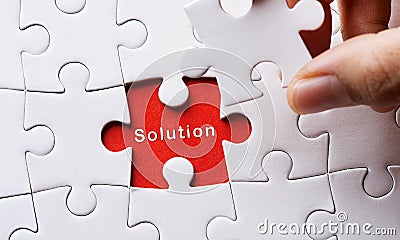 Image of Puzzle piece with solution Stock Photo