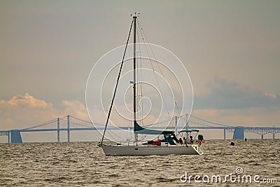 Image of a sailboat moving across Chesapeake Bay Editorial Stock Photo