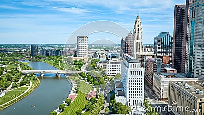 Scioto Mile Promenade with bridge over Scioto River leading to skyscrapers in downtown aerial Stock Photo