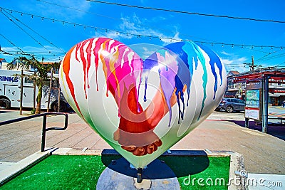 Sculpture in Castro District of heart with people holding hands on bright sunny day Editorial Stock Photo