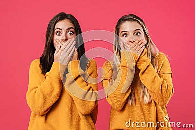 Image of shocked caucasian women covering their mouths Stock Photo