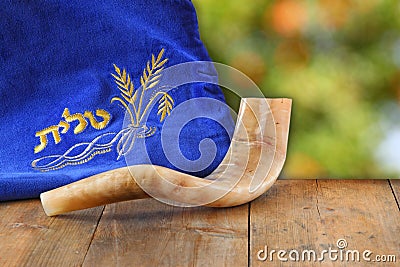 Image of shofar (horn) and prayer case with word talit (prayer) writen on it. room for text. rosh hashanah (jewish holiday) Stock Photo