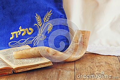 Image of shofar (horn) and prayer case with word talit (prayer) writen on it. room for text. rosh hashanah (jewish holiday) Stock Photo