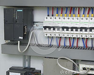 Image shows control cubicle. Schneider electric device and Schneider circuit breakers inside power case. Editorial Stock Photo