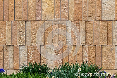 Modern rough textured limestone wall background with vertical aligned stone bricks Stock Photo