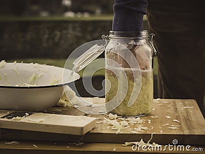 Pack homemade sauerkraut into a jar Stock Photo