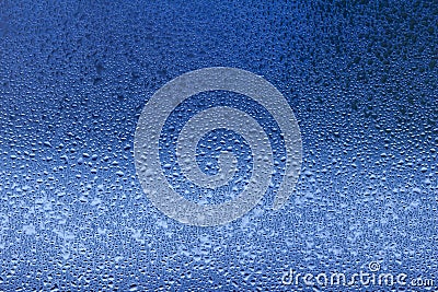 Macro abstract texture in blue color of moisture condensation on a glass window pane Stock Photo