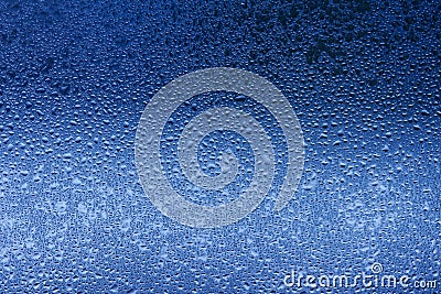 Macro abstract texture in blue color of moisture condensation on a glass window pane Stock Photo