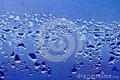 Macro abstract texture in blue color of moisture condensation on a glass window pane Stock Photo